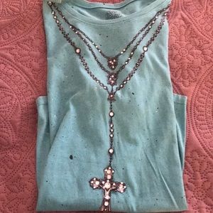 Turquoise tee shirt purchased from Harris leathers for horse showing